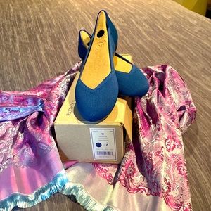 Rothy’s brand new Deep ocean color flats.